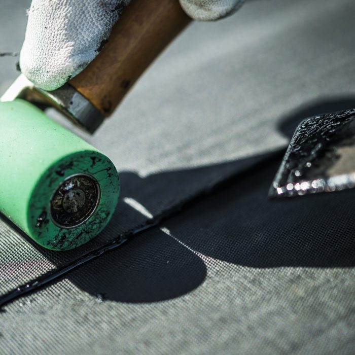 Roof Rubber EPDM Membrane Installation Close Up. Roofing Industry Theme.